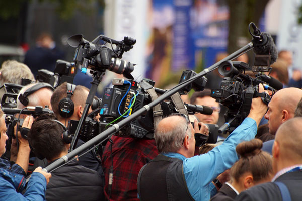 A photo of a media scrum often associated with Crisis Management services in Boston
